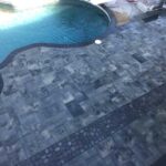 Custom fiberglass pool installation with patio and landscape design