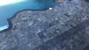 Custom fiberglass pool installation with patio and landscape design